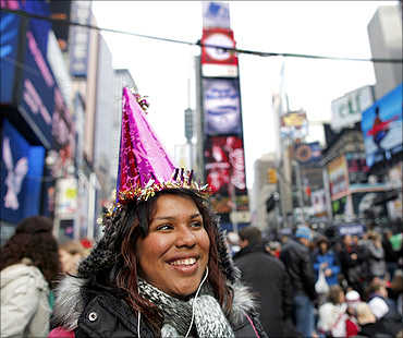 Daniela Calito from Los Angeles waits in Times Square during New Year's Eve celebrations in New York