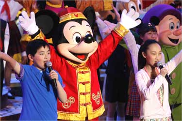 Dancers perform during the groundbreaking ceremony of Shanghai Disneyland.