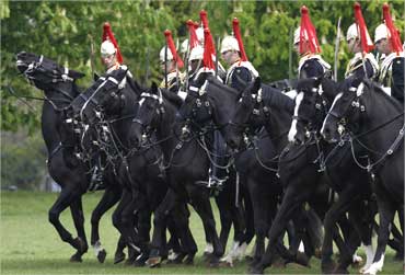 Members of the Household Cavalry take part in a dress rehearsal in Hyde Park, London.