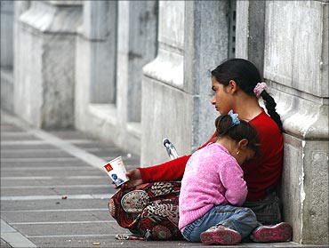 A beggar with her child in Athens.