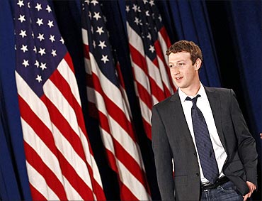 Facebook CEO Mark Zuckerberg arrives for the start of a town hall meeting with US President Barack Obama.