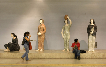Travellers waiting at a Lisbon subway.