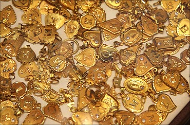 Gold souvenirs are displayed at jewellery shop.