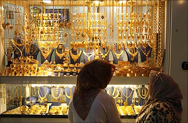 Women look at a jewellery shop.