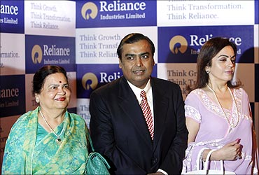 Mukesh Ambani with his mother, left, and wife, right.