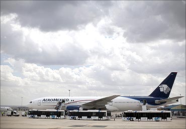 Passengers disembark from an Aeromexico Boeing 777.