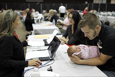 Rebecca Esquibel, Nathan Glidden, their 1 month-old daughter Aliyah attend a Bank of America mortgage modification outreach.