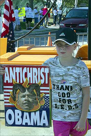 A young member of the Westboro Baptist Church of Topeka, Kansas, protests in Houston.