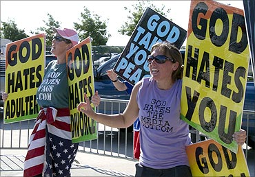 Members of the Westboro Baptist Church of Topeka, Kansas, protest as a call to prayer for a nation.