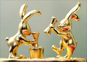 An artwork of rabbits pounding rice-cakes, decorated with 20g of 24K gold in Tokyo.