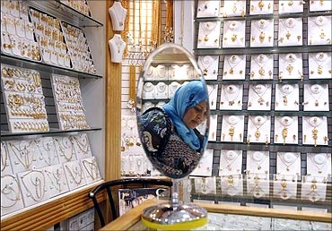 A shopper browses in a jewelry store at the Gold Centre in Abu Dhabi.