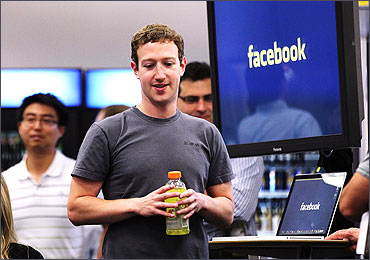 Facebook CEO Mark Zuckerberg prepares to speak at a news conference.