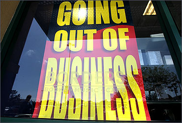 A sign is displayed in the window at a Borders Bookstore.
