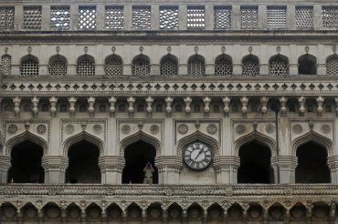 A security personnel keeps an eye from Charminar in Hyderabad.