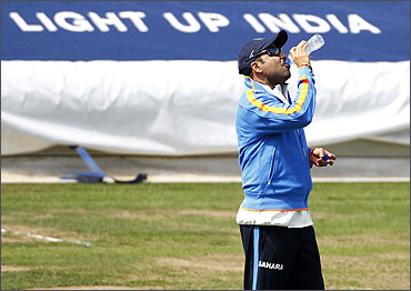 Virender Sehwag drinks during a cricket training session at Edgbaston.