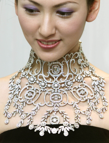 A model displays a diamond neckpiece in Hong Kong.