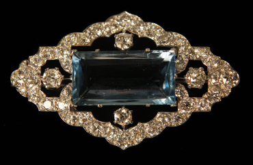 An aquamarine and diamond brooch is displayed at Bentley and Skinner jewellers in London,