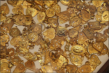 Gold souvenirs are displayed at jewellery shop in Amman.