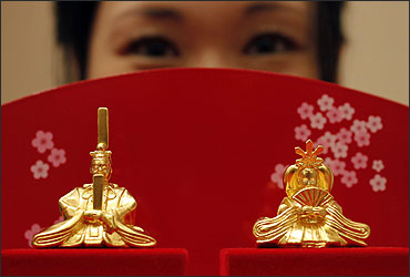 Japanese ornamental hina dolls, made of pure gold, is unveiled at the Ginza Tanaka store in Tokyo.