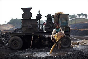 A boy works at a coal depot Lad Rymbai, in the district of Jaintia Hills.