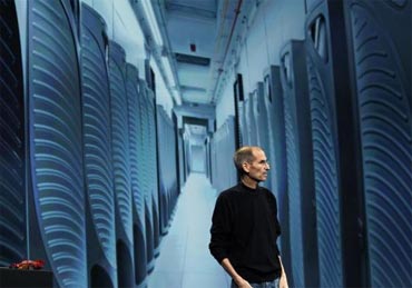 Jobs is pictured with an image of server farm in Maiden, North Carolina.