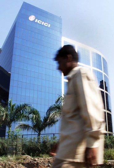 A man walks past the ICICI's headquarters in Mumbai.
