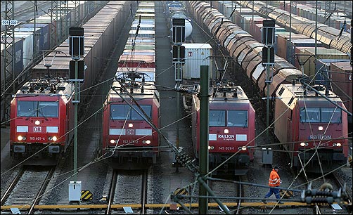 Worker passes parked locomotives in Europe's biggest marshalling yard in Maschen, near northern German town of Hamburg.