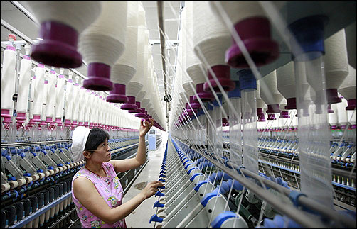 A labourer works at a textile mill in Huaibei.