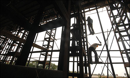 Labourers work on a flyover.