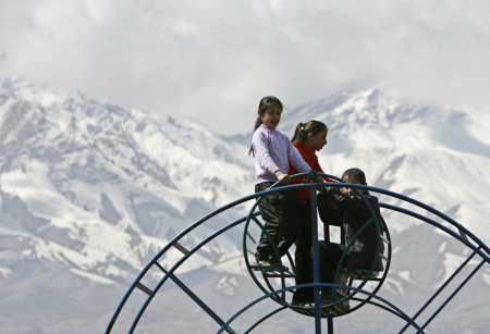 Children ride on a Ferris wheel in Kabul.