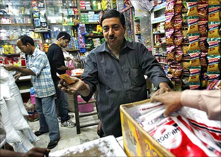India puts FDI in retail on hold; govt gives in to pressure