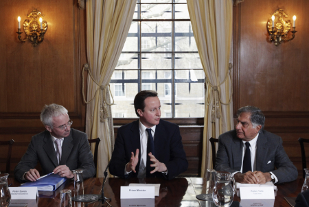 Britain's Prime Minister David Cameron, centre,  is flanked by CEO of Standard Chartered Peter Sands, left.  and Ratan Tata  at Number 10 Downing Street in London.