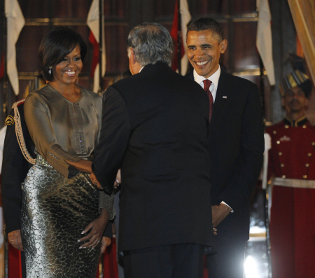 US President Barack Obama and First Lady Michelle Obama greet Ratan Tata in New Delhi.