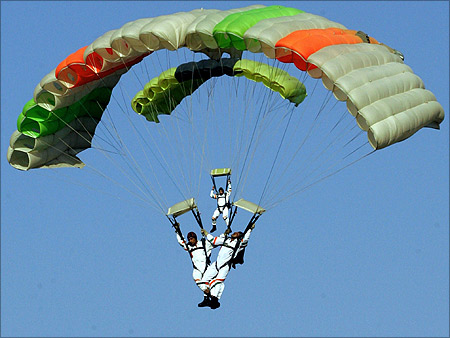 Indian Air Force sky divers parachute at Hindon airport in Ghaziabad.