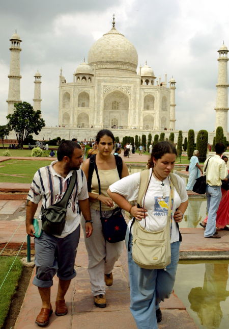 Foreign tourists visit the Taj Mahal in the tourist city of Agra.