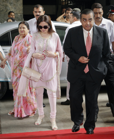 Mukesh Amban with his mother Kokilaben, left, and wife Nita, centre, in Mumbai.