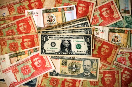 Cuban and US notes are seen in this illustrative photograph taken in Havana.