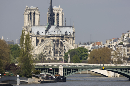 View of Notre Dame Cathedral in Paris from the banks of the river Seine in Paris.