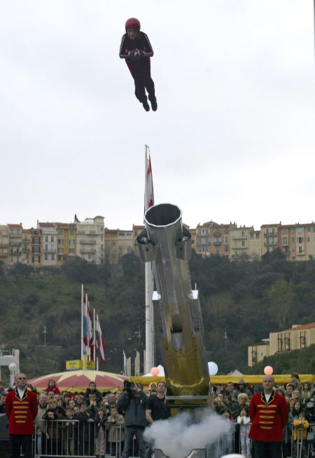 A circus performer soars from a cannon during the Open Air Show parade in Monte Carlo.