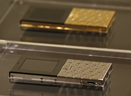 Mobile phones plated in stainless steel and 18-carat gold are shown at a luxury goods department store in Hong Kong.
