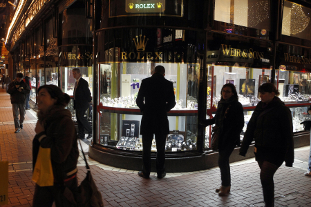 A man looks at a window display of jewellery on Grafton Street in Dublin.