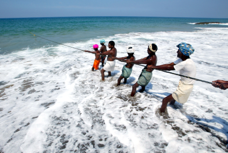 Fishermen pull in their catch in Kovalam Beach, about 20 km south of Trivandrum
