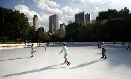 People skate on the Wollman ice rink in Central Park.
