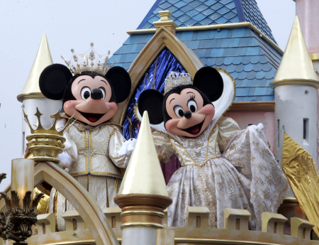Mickey and Minnie Mouse take part in a Disneyland parade.