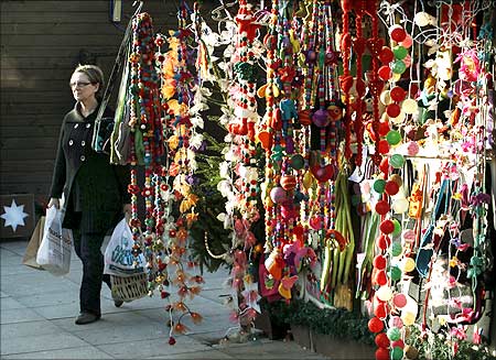 A pedestrian passes a shop selling Christmas goods in Brighton southern England.