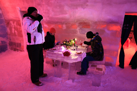 Tourists have dinner inside the Balea Lac Hotel of Ice in the Fagaras mountains.
