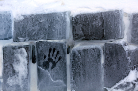 A hand print is seen on the outside wall of the Balea Lac Hotel of Ice in the Fagaras mountains.