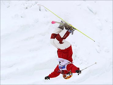 Jennifer Heil, Canada does a backflip during Freestyle Ski Mogul's World Cup Ladies' competition.
