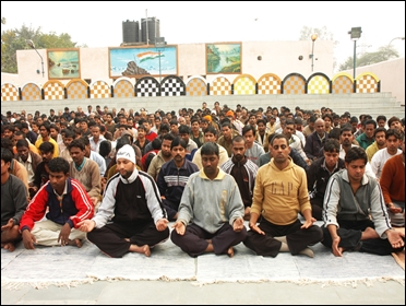 Tihar Jail inmates meditate.