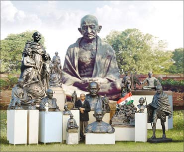 A collection of Gandhi statues. Also seen in the picture is Ram Sutar.